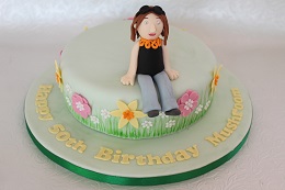flower and figure birthday cake